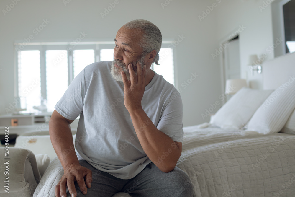 Man sitting on the bed Man sitting on the bed