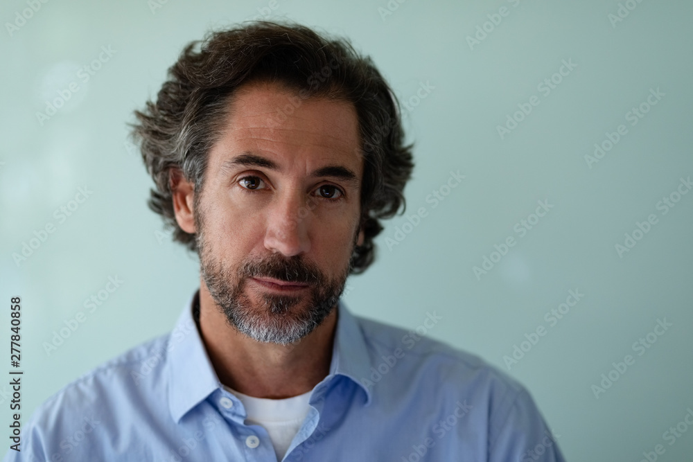Fototapeta premium Businessman looking at camera in office