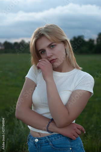 Portrait of beautiful blonde outdoors, young blonde posing outdoors © vulkanov