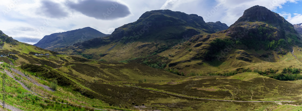 Panoramic view of The Three sisters , also known as Bidean nam Bian Mountain in the Scottish Highlands in summer , Glen Coe , Scotland Panoramic view of The Three sisters , also known as Bidean nam Bian Mountain in the Scottish Highlands in summer , Glen Coe , Scotland
