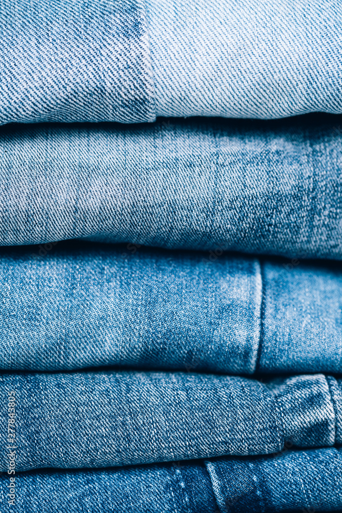 Stack of jeans on table. Zero vaste concept. Ecology and recycling. Stack of jeans on table. Zero vaste concept. Ecology and recycling.
