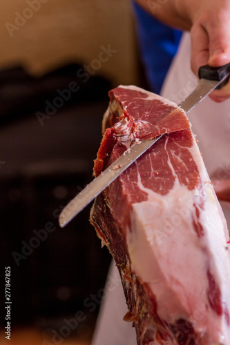 Iberian ham cut with knife