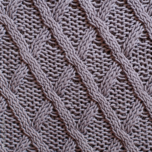 Creamy grey knitted texture background. Square crop, top view