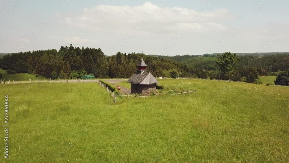 Little Chapel in a hill in Eifel national park Germany, Aerial Little Chapel in a hill in Eifel national park Germany, Aerial