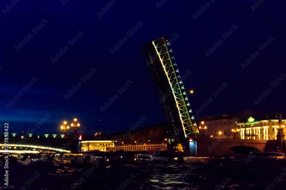 Opening of Trinity drawbridge. Night view of Trinity bridge from the Neva river in St. Petersburg, Russia Opening of Trinity drawbridge. Night view of Trinity bridge from the Neva river in St. Petersburg, Russia
