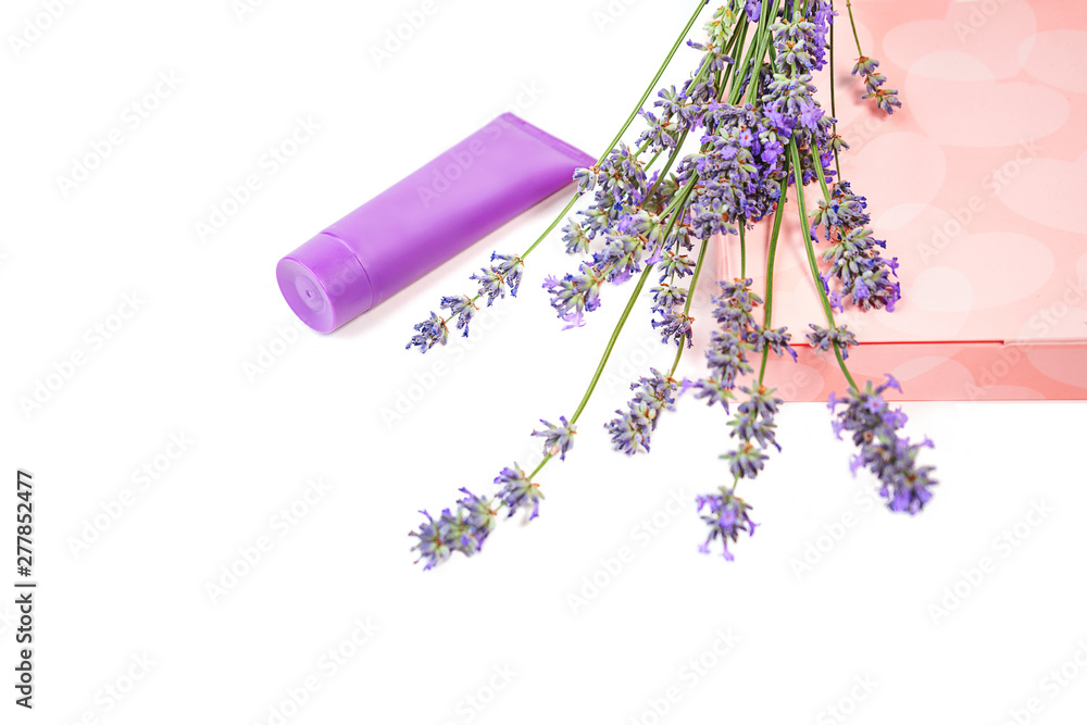 Cosmetic cream and lavender flowers, gift box with sweets on white background, isolated. Beauty, medical clinic, spa concept. Cosmetic cream and lavender flowers, gift box with sweets on white background, isolated. Beauty, medical clinic, spa concept.