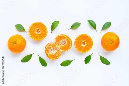 Fresh orange citrus fruit with leaves isolated on white.
