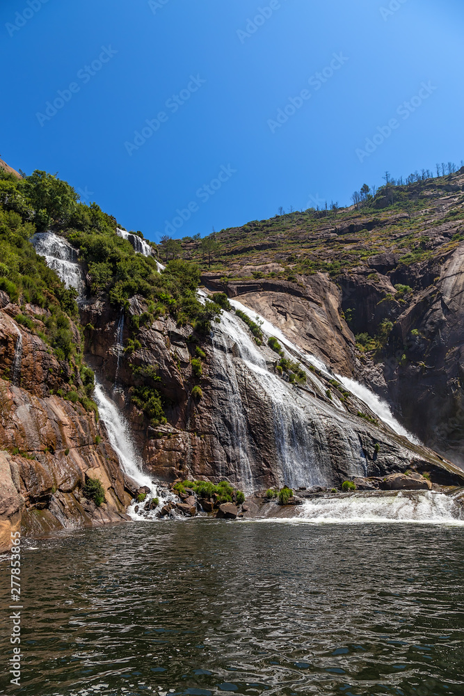 Ezaro, Spain. Scenic waterfall in the rocks