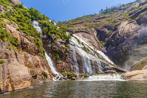 Ezaro  Spain. Scenic waterfall among the rocks