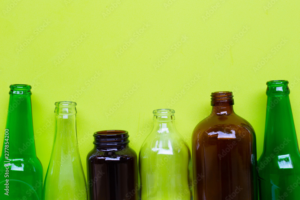 Glass bottles on green background. Glass bottles on green background.