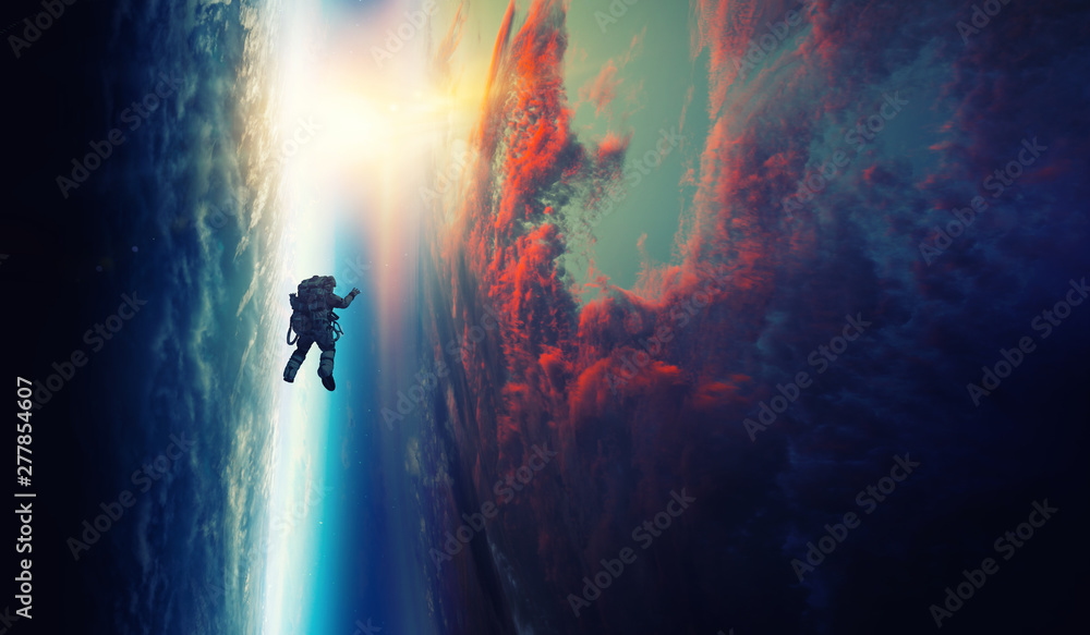 Spaceman and planet, human in space concept - obrazy, fototapety, plakaty 