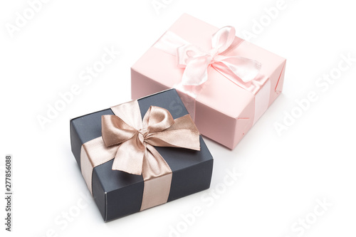 beautiful gift boxes wrapped in paper with gold and pink ribbon isolated © Nana_studio
