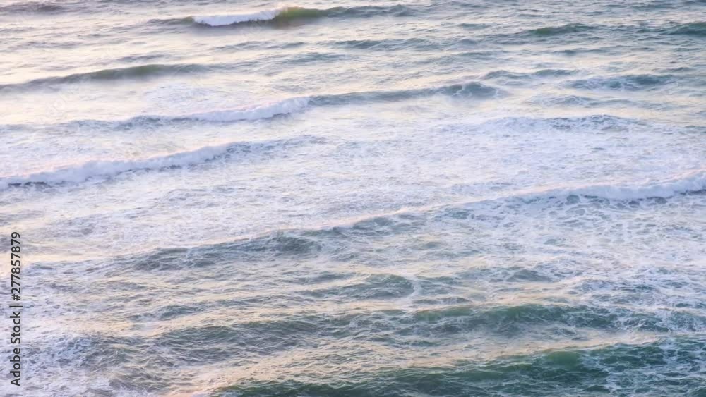 Tropical beach aerial view, Top view of waves break on tropical white sand beach. Sea waves seamless loop on the beautiful sand beach. Tropical beach aerial view, Top view of waves break on tropical white sand beach. Sea waves seamless loop on the beautiful sand beach.