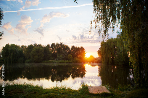 gorgeous sunset on a small fishing lake. photo