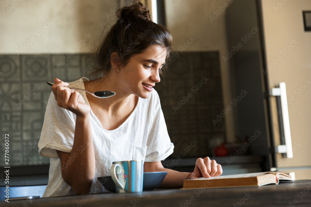 Attractive young woman having healthy breakfast Attractive young woman having healthy breakfast