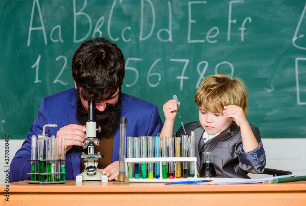 Where Learning Begins. father and son at school. bearded man teacher with little boy. confidence & charisma. Back to school. Pupil kid in the chemistry class Science chemistry concept Where Learning Begins. father and son at school. bearded man teacher with little boy. confidence & charisma. Back to school. Pupil kid in the chemistry class Science chemistry concept