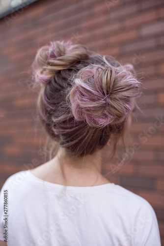 Hair styling rear view, brown pink color bun iroquois hairstyle on background