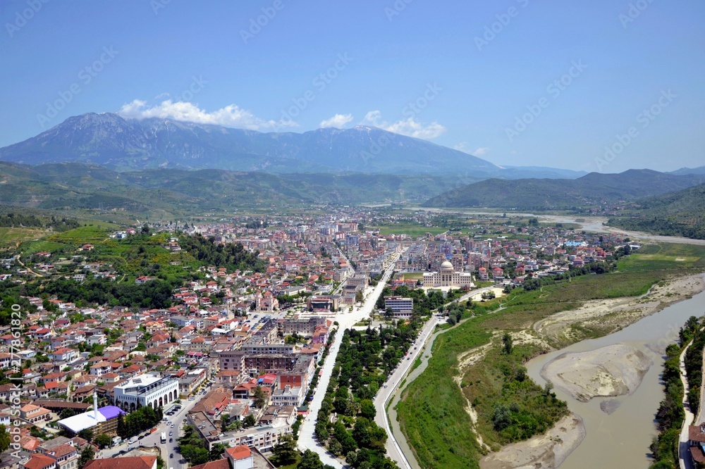 The albanian city of Berat, designated a UNESCO World Heritage Site in 2008. Top view from the Berat Castle to the city center and Tomorr Mountain  (Mount Tomorr) in the background. Albania