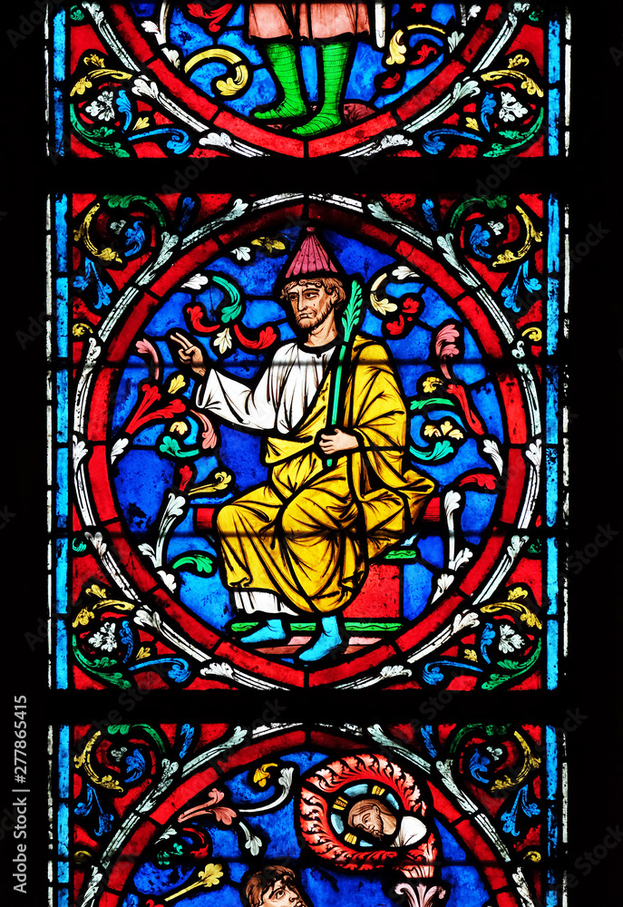 Colorful stained glass window in the Notre Dame Cathedral, UNESCO World Heritage Site in Paris, France 