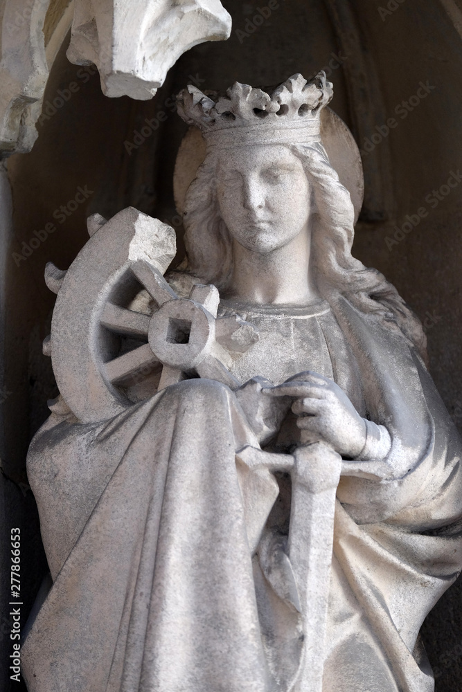 Saint Catherine of Alexandria on the portal of Parish Church of the Holy Blood in Graz, Styria, Austria