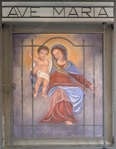 Virgin Mary with baby Jesus, house facade in Lugano, Switzerland