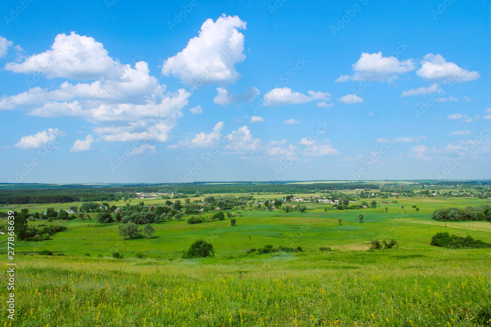 Green field and blue sky background. Landscape, nature concept. Nature Background.
