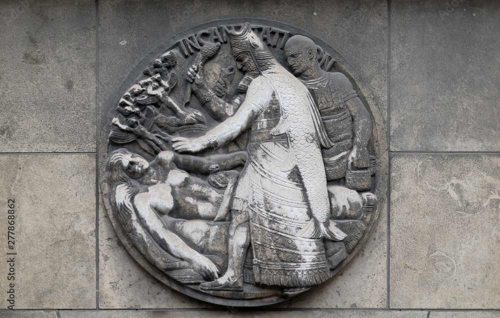 Incantation. Stone relief at the building of the Faculte de Medicine Paris, France