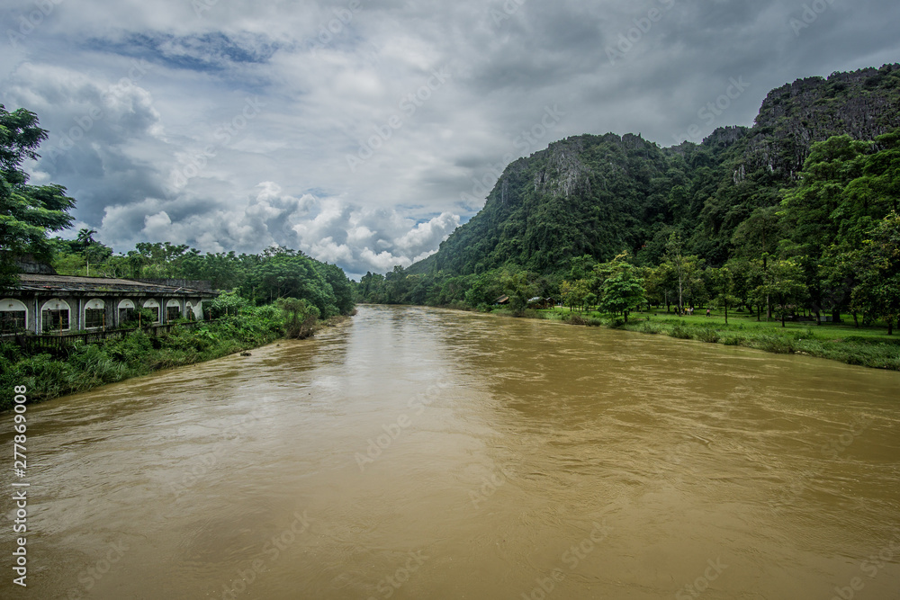 Beautiful day around the fields and the dirt roads of Vang Vieng area in Laos.  This place feels out of this world , full of green mountains and rice fields , blue lagoons and rivers.  