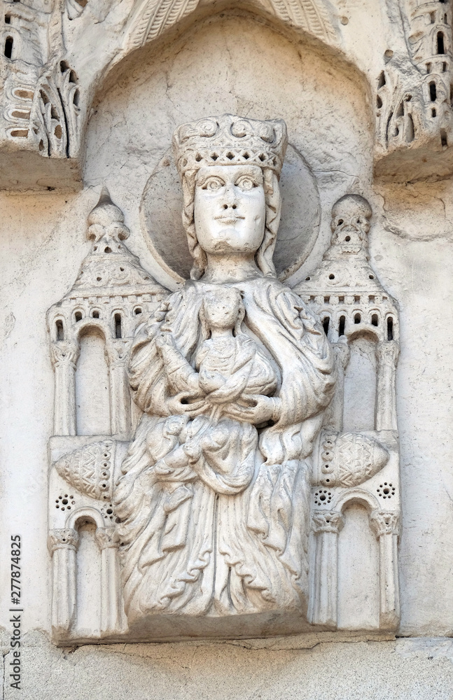 Enthroned Madonna, portal of Santa Maria Forisportam church in Lucca, Tuscany, Italy 