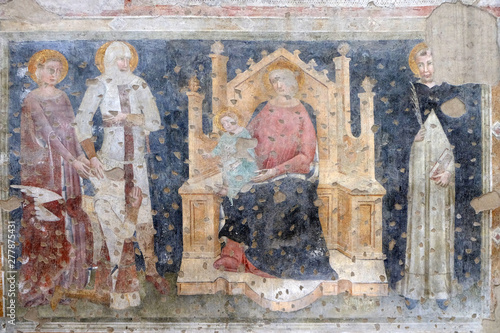 Enthroned Madonna and Child, Saints Catherine, George, Peter the Martyr and a worshipper Knight fresco in the church of San Pietro Martire in Verona, Italy