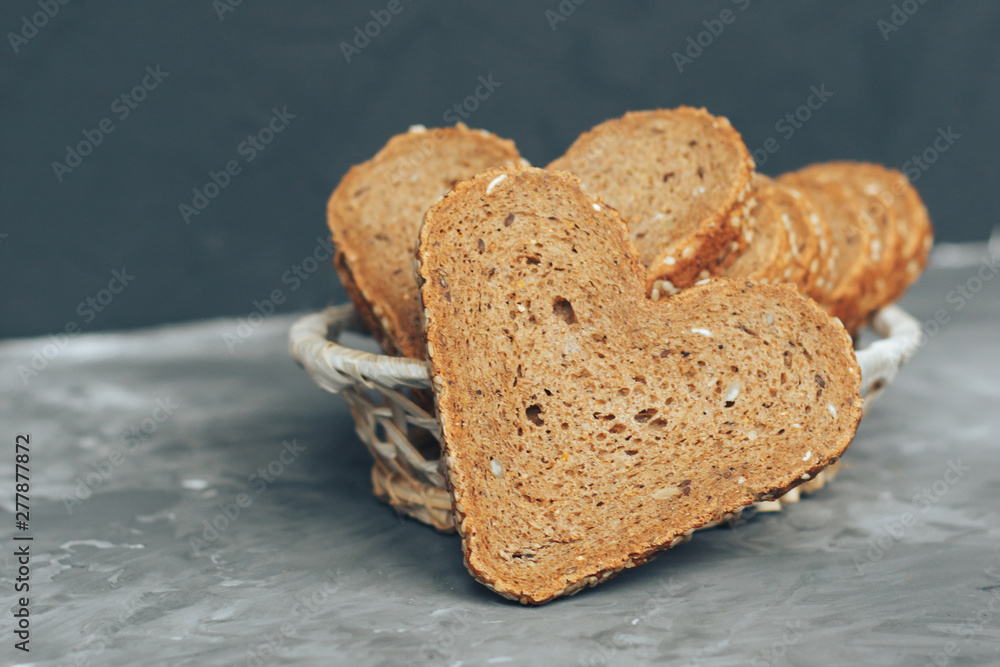 custom made wallpaper toronto digitalRye bread in the shape of heart cut into slices on a gray background