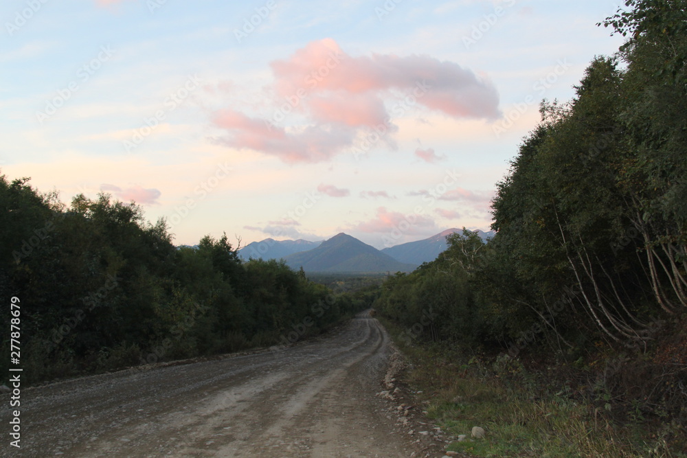 The road at the foot of the volcano in Kamchatka. Scenic vi