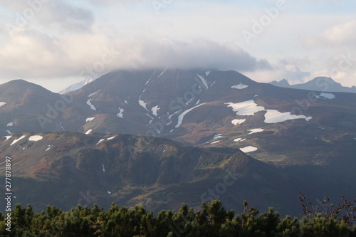 The top of the volcano in Kamchatka is shrouded in vapors  a beautiful mountain landscape.