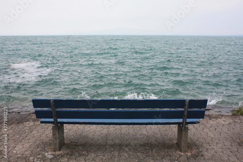 Blue bench on the lake in Switzerland. © Malira