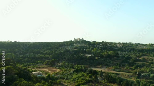 Revealing aerial video of the fields of Buskette approaching the Palace of Verdala, Malta. photo