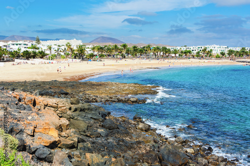 View of Playa de las Cucharas beach in Costa Teguise, Lanzarote, Spain, turquoise waters, selective focus photo