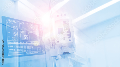 Holter heart rate monitoring machine overlay with Medical drip and infusion pump for saline or salt fluid water on soft blue hospital clinic color theme. Concept for healthcare, medical treatment.