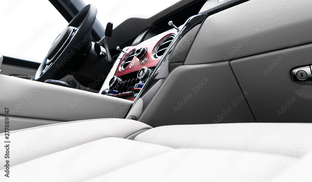 Modern luxury car white leather interior with natural wood panel. Part