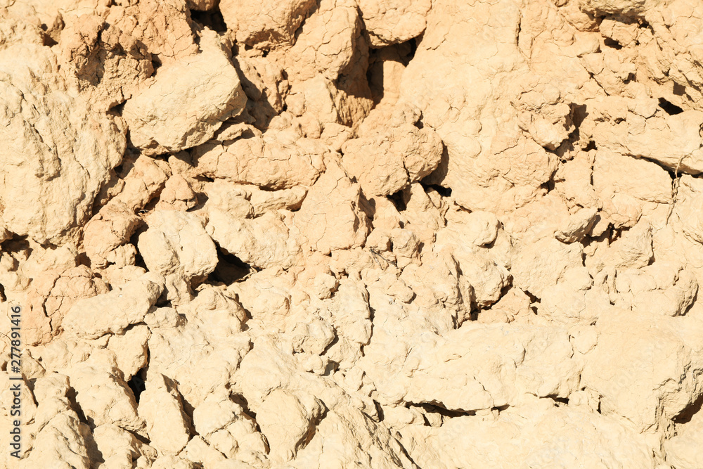 Cracked clay soil of rock. Erosion from storms Cracked clay soil of rock. Erosion from storms