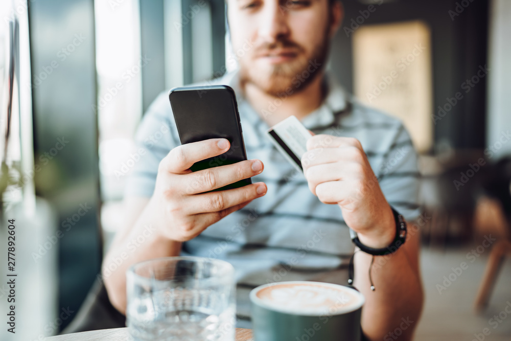 close up details of smart phone and credit card. shopping online with credit card close up details of smart phone and credit card. shopping online with credit card