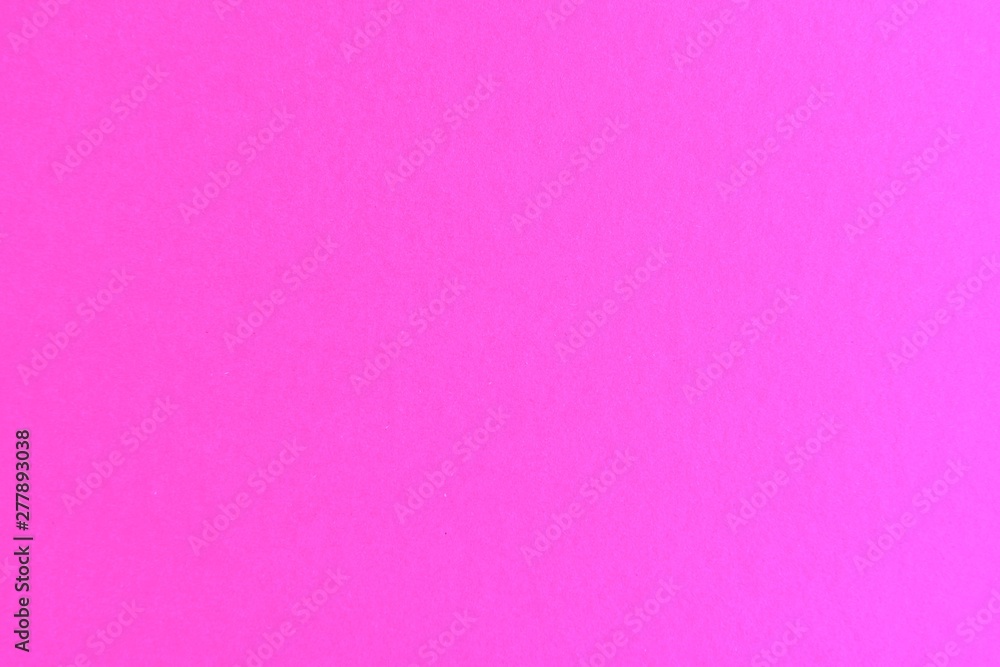 Pink textured paper background. Blank backdrop with empty space for image or text. Mockup concept. Neon empty paper background. Clean pink wallpaper. A pink sheet of paper. Paper board. Cardboard 