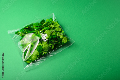 Fresh baby greens in disposable plastic package
