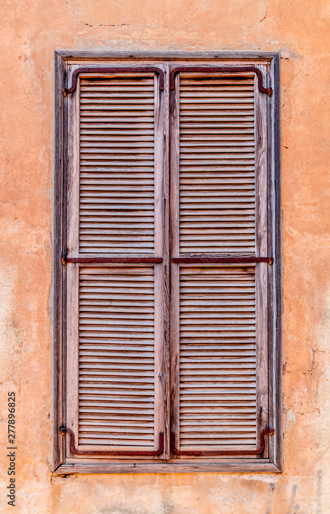 Windows with old wooden shutters