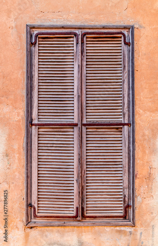 Windows with old wooden shutters © EnginKorkmaz
