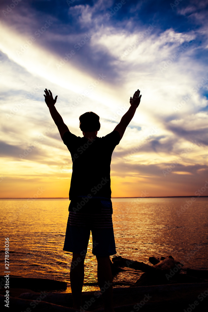 Fototapeta premium Man Silhouette with Hands Up