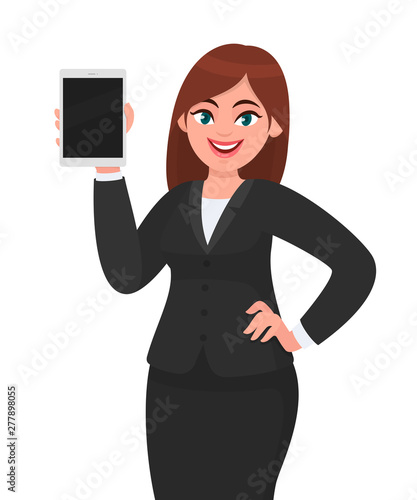 Young business woman showing or holding a blank screen digital tablet computer in hand. Female character design illustration. Modern lifestyle, technology gadget concept in vector cartoon style.