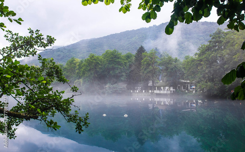 Gazebo for relaxing on the shore of the blue karst lake Cerik-Kel in cloudy foggy weather  Kabardino-Balkar Republic  Russia