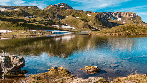 Beautiful alpine view with a lake with reflections at the famous Grossglockner High Alpine Road, Salzburg, Austria