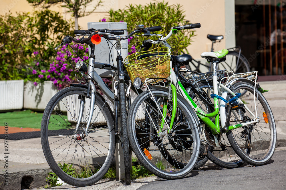 Parked bicycles at the beautiful streets of Pisa