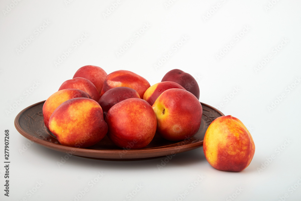 Ripe juicy nectarines isolated on white background Ripe juicy nectarines isolated on white background